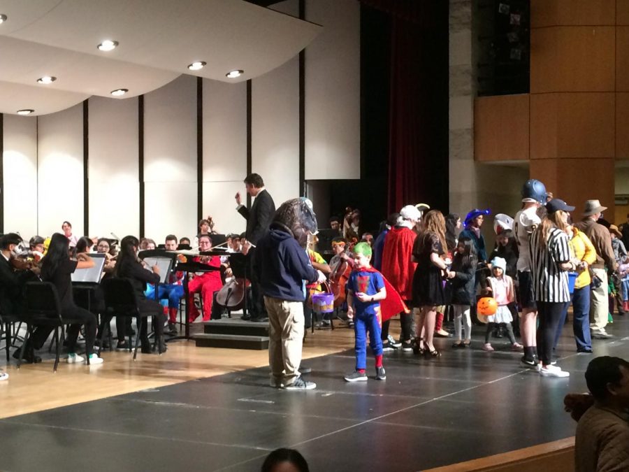 The Wildcat Fiddlers lead the costume parade and hand out candy while the Neuqua Valley Symphony Orchestra plays “The Phantom Regiment.” 
