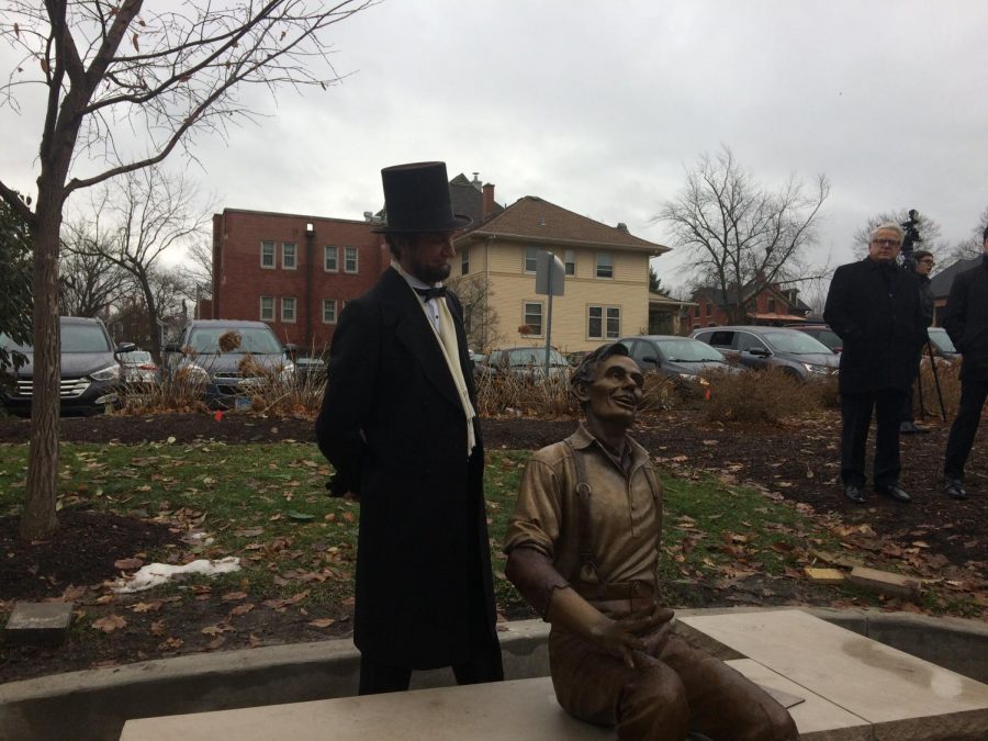 Abraham Lincoln regards his younger, metallic counterpart.