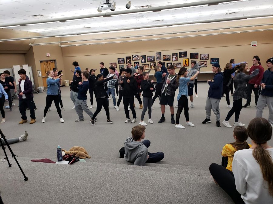 The Orchesis Dance Company  prepares for their Showcase on January 31st and February 1st and 2nd. The dancers and their partners are practicing for their 2019 partner dance. Photo by Summer Moore. 
