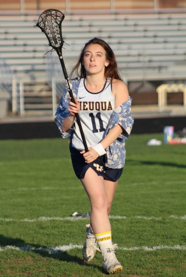 Payton Metry, captain of the Neuqua Valley Girls Lacrosse Team, is ready to catch the ball. Photo Courtesy of Payton Metry 