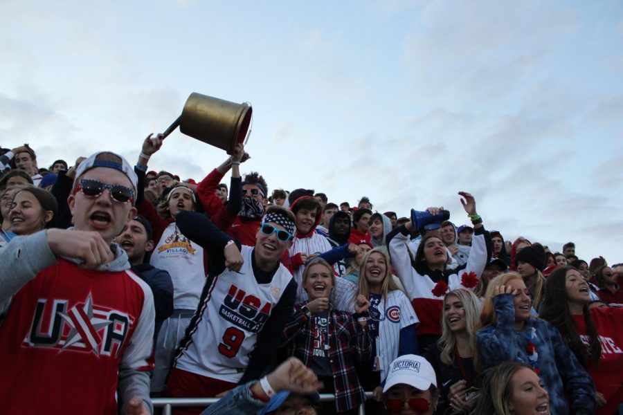 The+Gold+Rush+Section+cheering+for+the+Wildcats+as+they+play+Waubonsie+Valley+High+School.+Gold+Rush+leader%2C+Bobby+Sommers%2C+leading+chants+with+the+Golden+Bucket.+