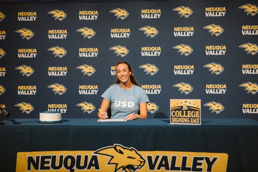 Jane Riehs smiles while signing her National Letter of Intent to commit to the University of San Diego on Nov. 11, 2020. 