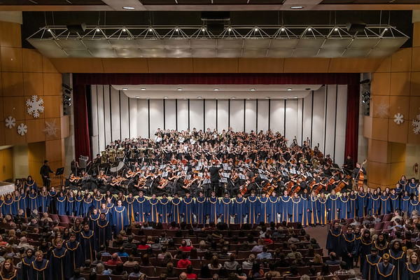 The various groups involved in Neuqua Valley’s annual Crystal Concert gather together to perform their final piece of 2019. All performers are present on and along the stage for the finale.