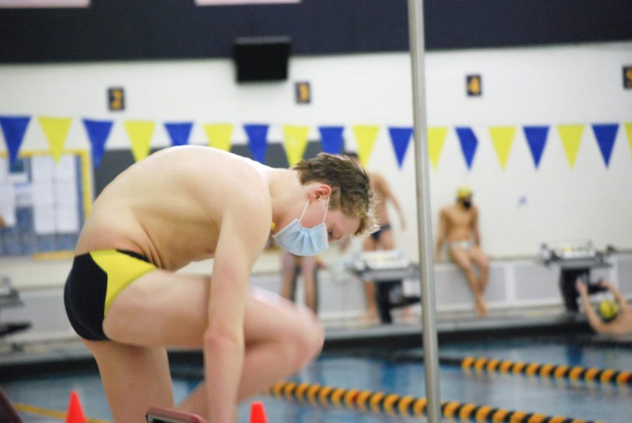 Swimmer Ian Alamaugh prepares for an event during the first swim meet back.