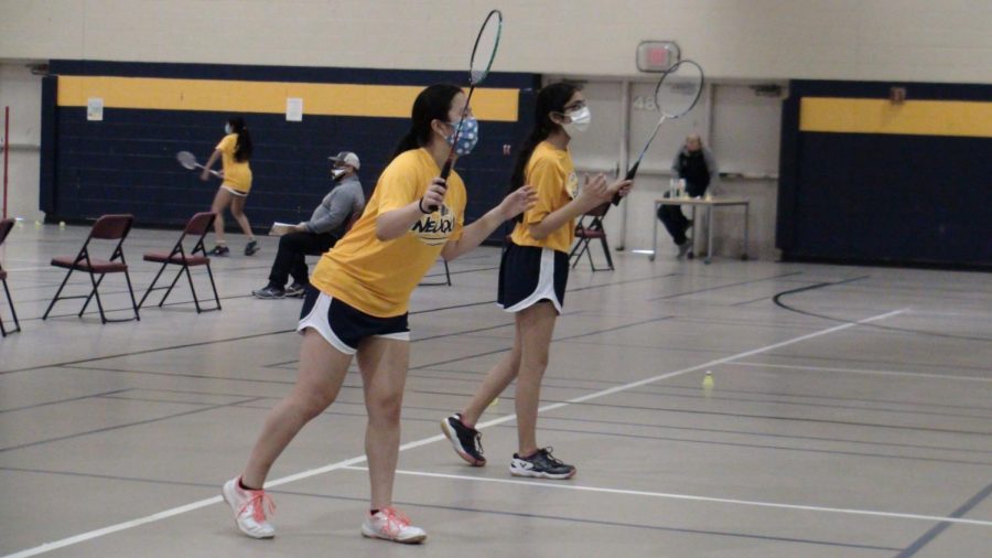 JV team captains Karena Liang (left) and Preena Shroff (right) getting ready to return in their doubles match