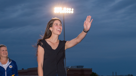 Paige Stevens waves at her daughter as shes inducted into the Athletic Hall of Fame.