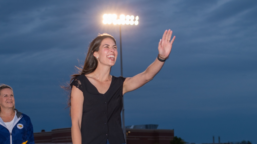 Paige Stevens waves at her daughter as she's inducted into the Athletic Hall of Fame.