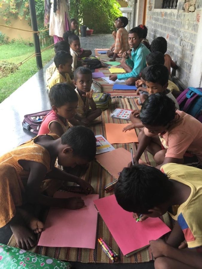 Students in India coloring with the crayons received through the Colors4Change program. 
