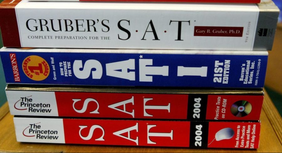 A stack of standardized test books, typically used by students to prepare before the exam.