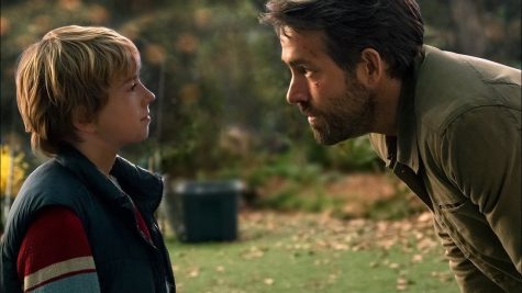 Young Adam Reed (Walker Scobell) interacting with his future self (Ryan Reynolds)