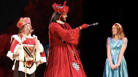 The King and Queen of Hearts talk with Alice