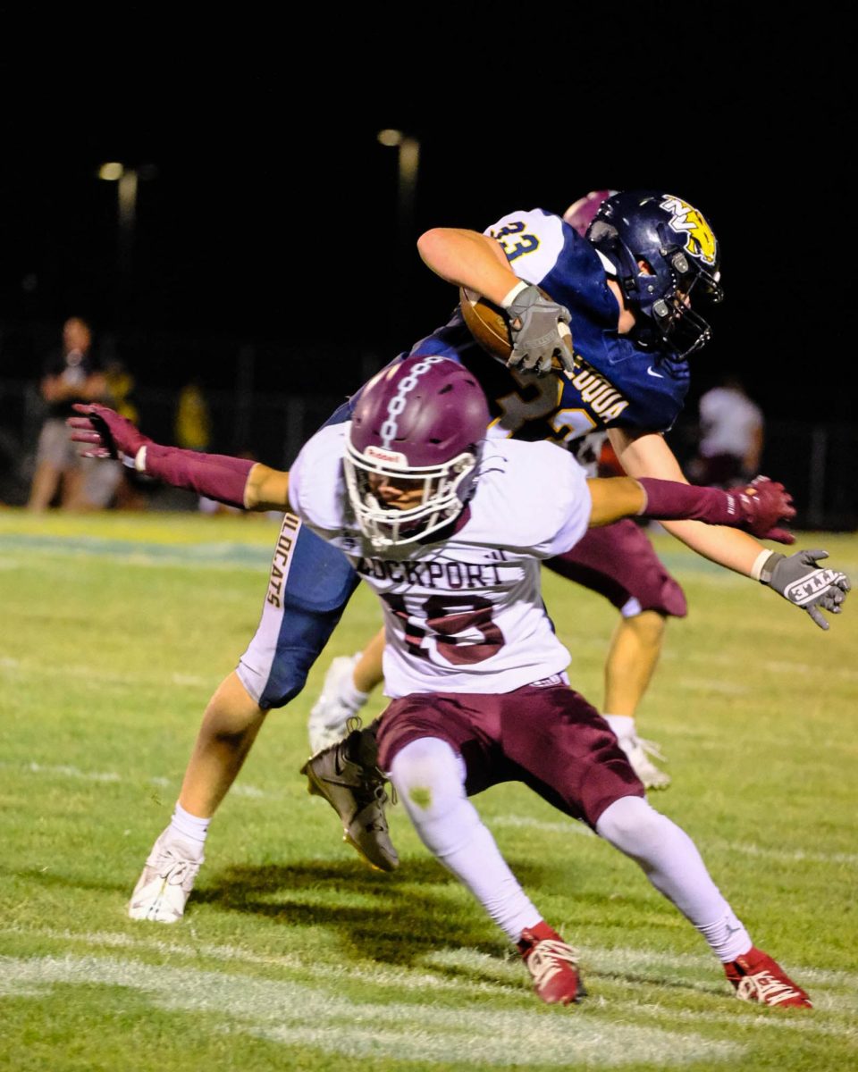 Neuqua player dives through Lockport defense